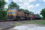 Two [Es lead a tank car train west on the Houston Sub 